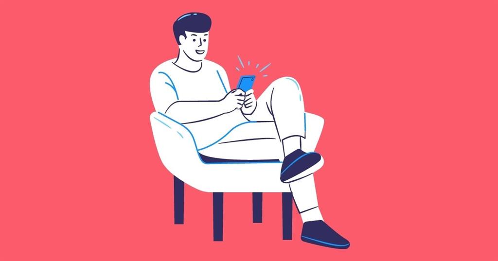 Man sitting in chair while on social media illustration
